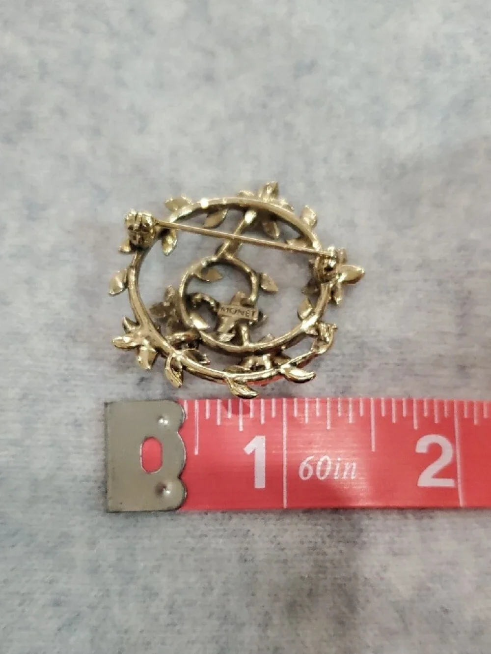Monet Gold-Tone Floral Circle Brooch with Green, Purple, Blue Stones